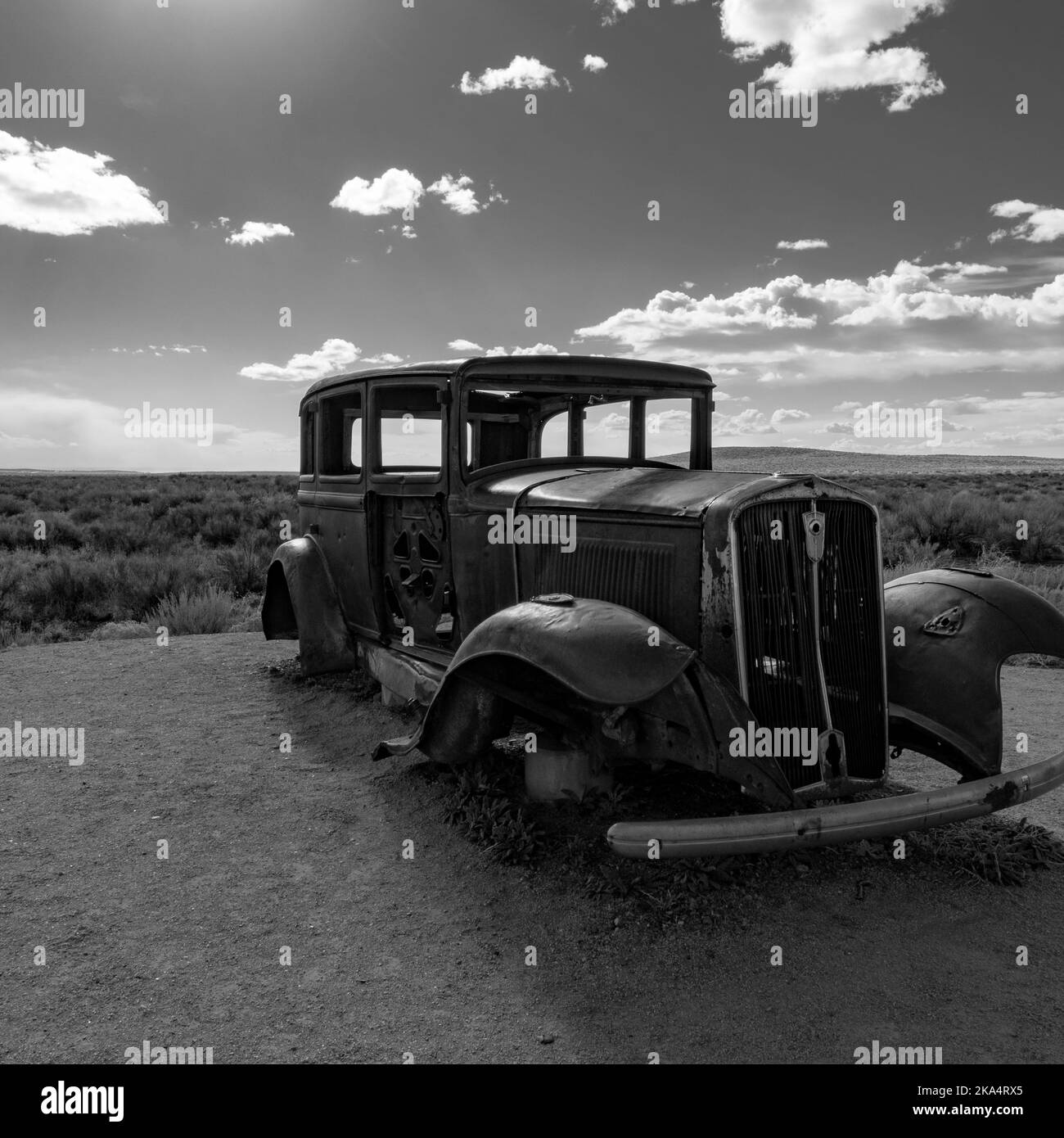 Petrified Forest National Park, AZ / USA - 4 March 2022: A 1932 Studebaker sits in scrubland along and old section of Route 66. Stock Photo