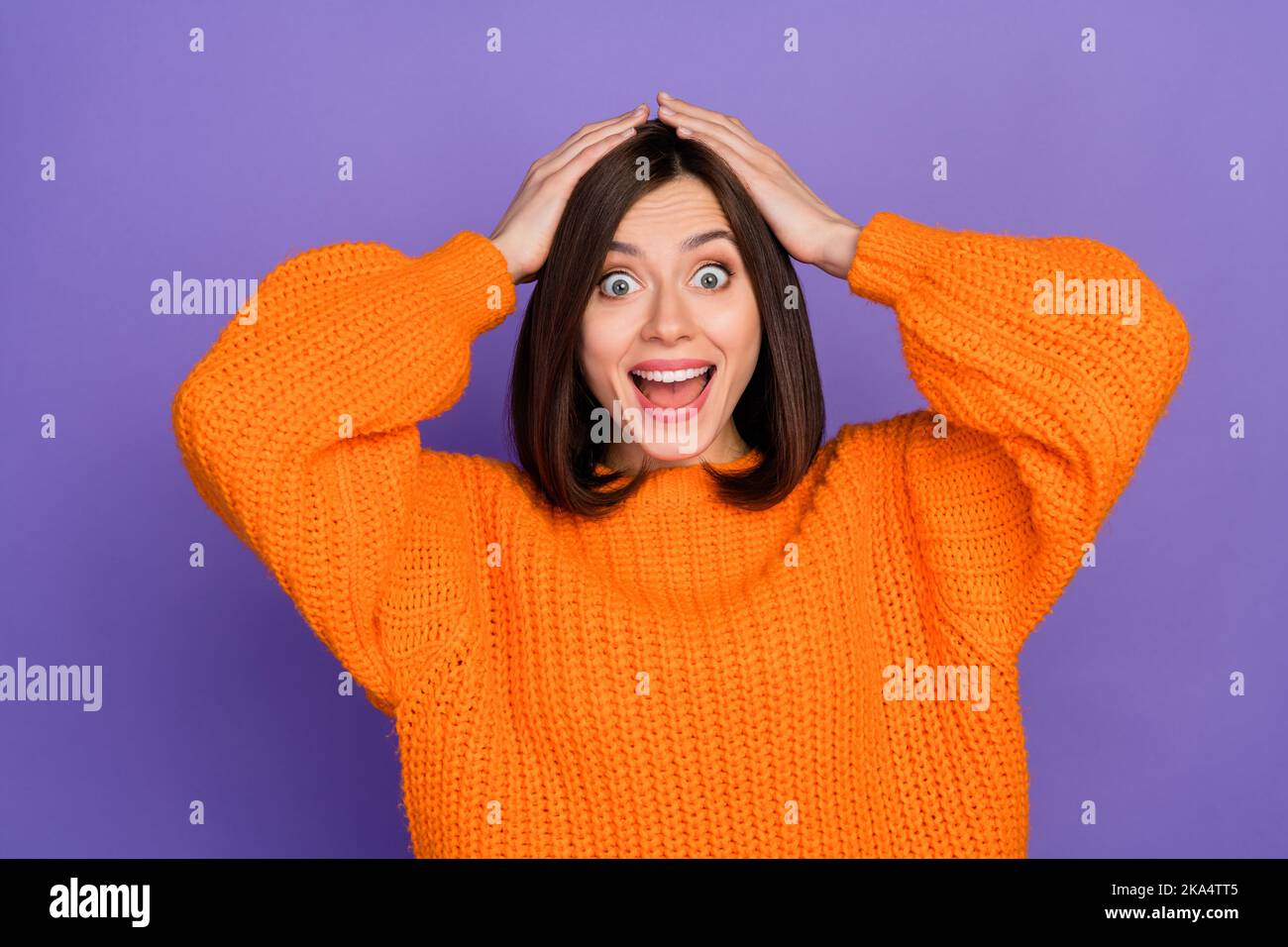 Photo portrait of stunning young girl arms touch head astonished wear ...
