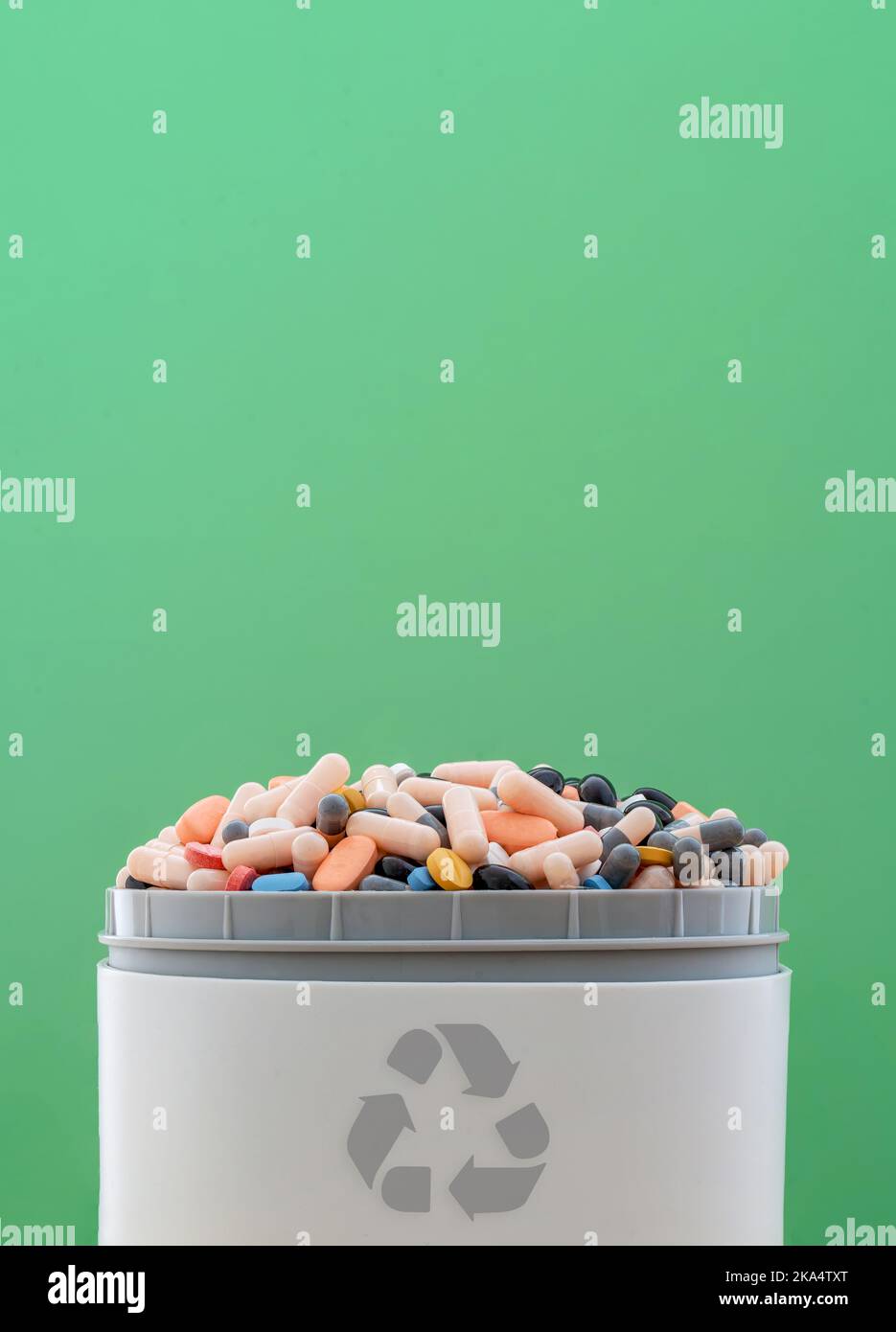 Full of expired pills and medicines in the trash bin with recycling