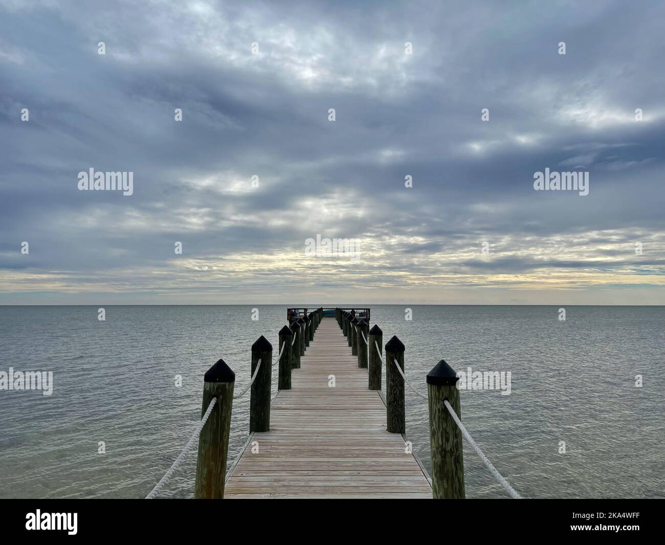 Empty wooden pier on an overcast day, Florida Keys, Florida, USA Stock Photo