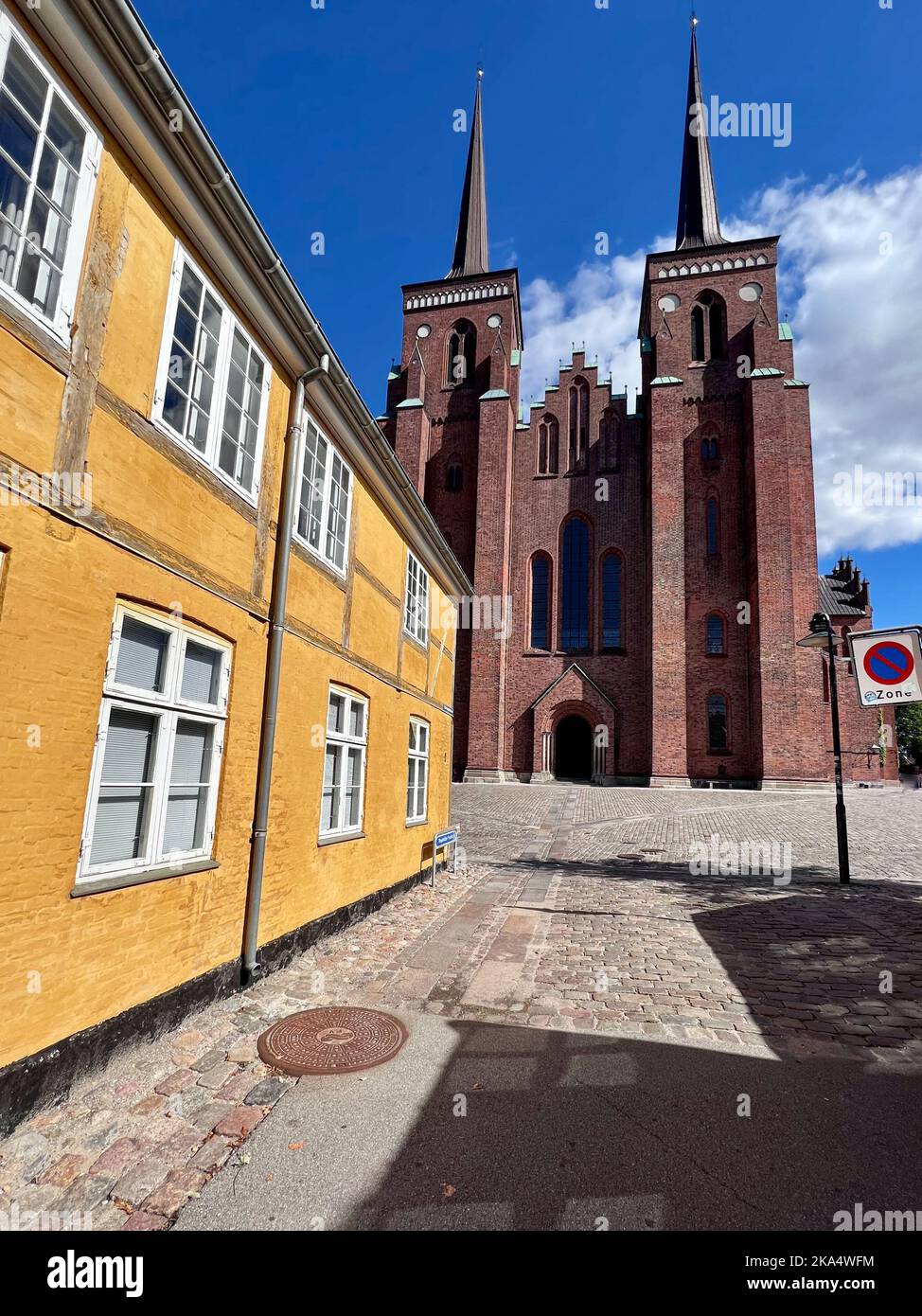 Roskilde Cathedral facade and traditional houses, Roskilde, Zealand, Denmark Stock Photo