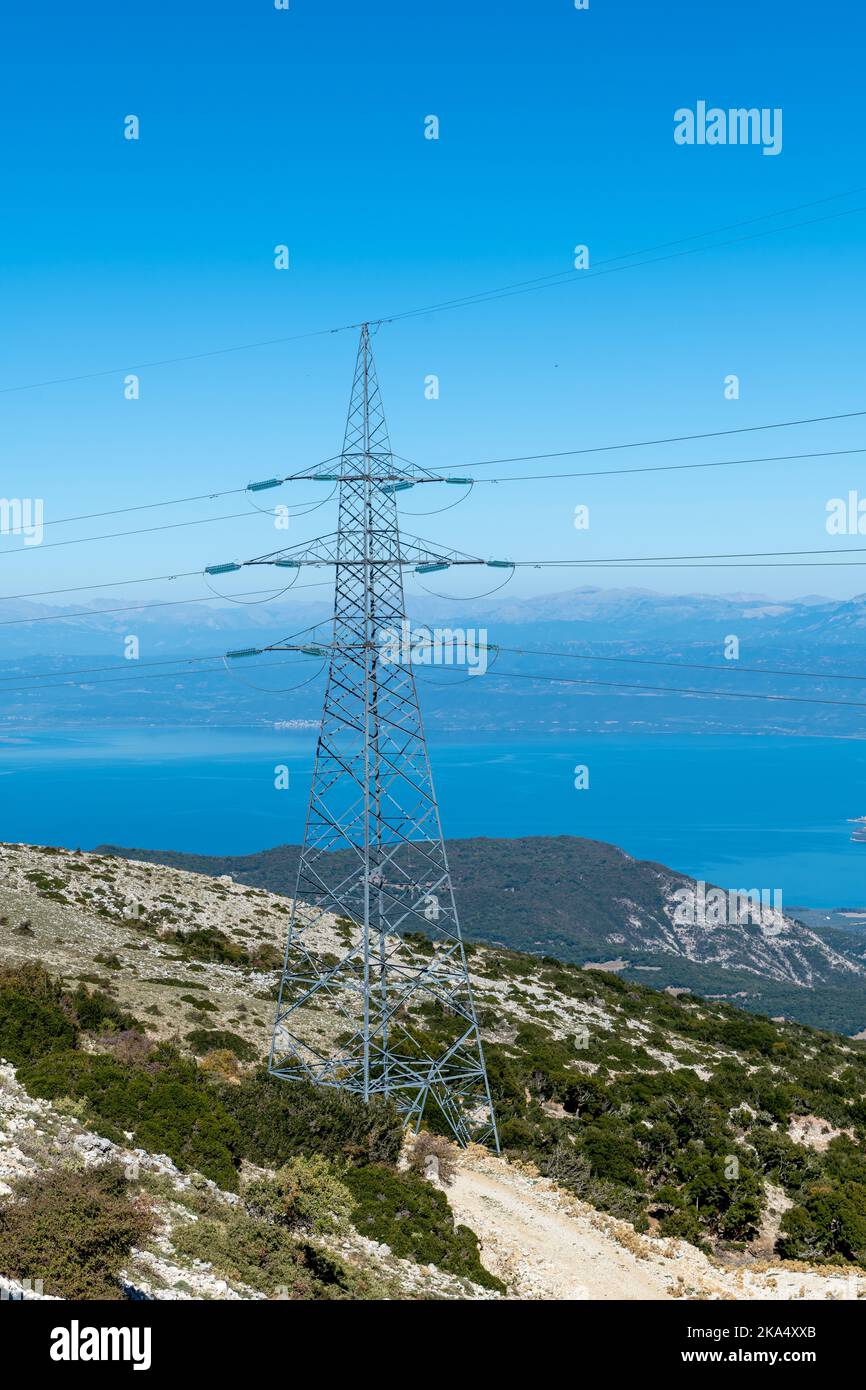 A electricity transmission tower or pylon on top of mountain. Stock Photo