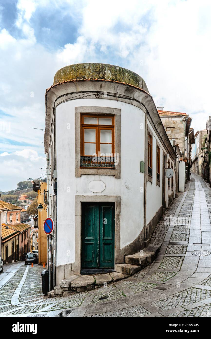 Downtown of Porto,Portugal.Cobblestone street with typical portuguese buildings,wooden doors.Urban travel concept.Old town of Oporto.City architecture Stock Photo