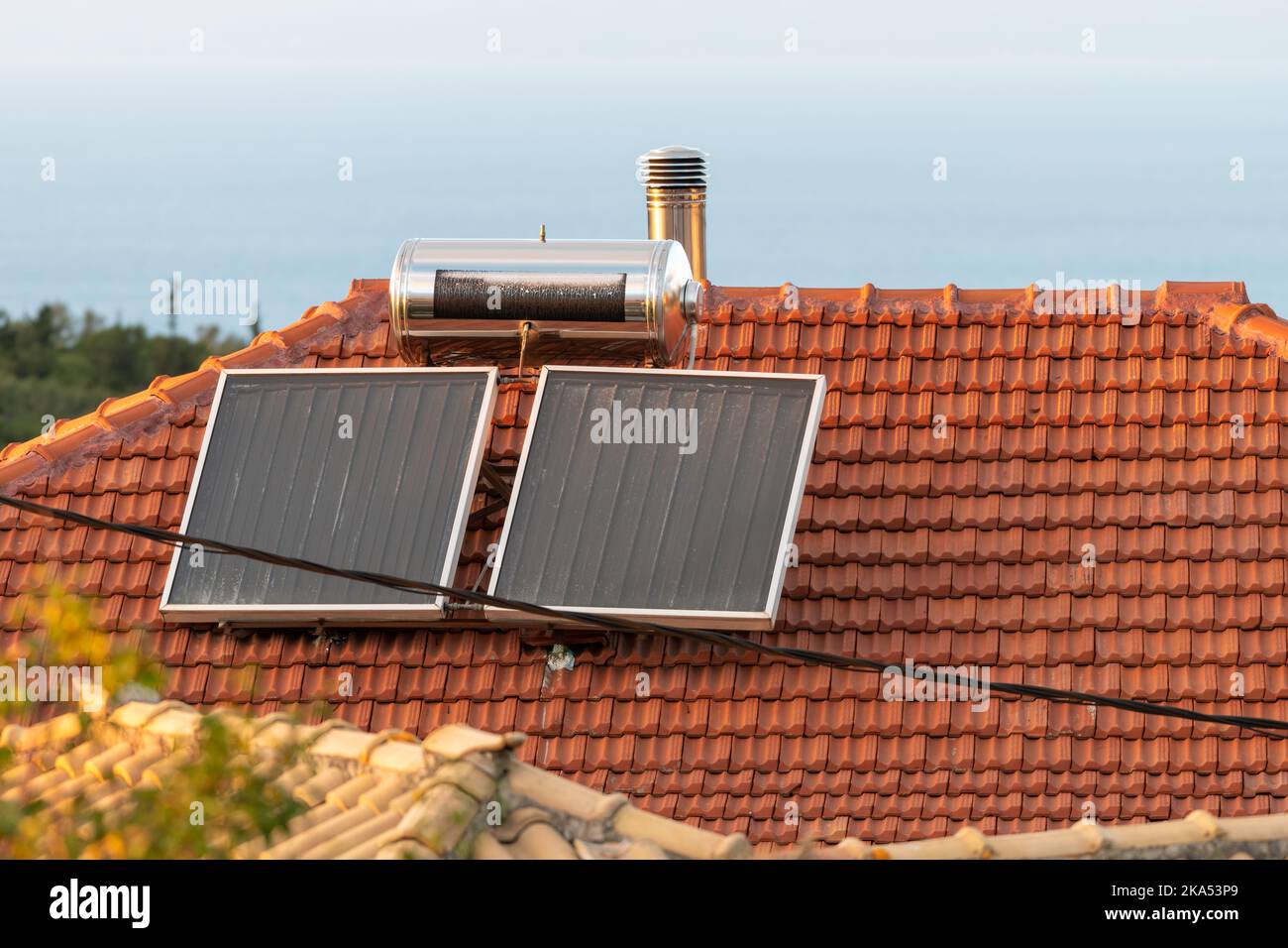 Domestic solar panels on a roof top for hot water heating Stock Photo ...