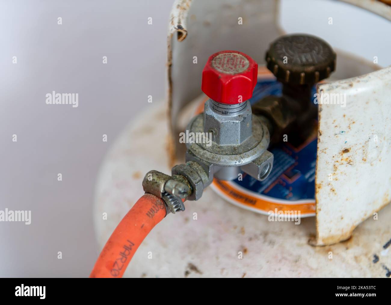 Close up of a bottle of Liquefied Petroleum Gas with a pipe connected. Stock Photo