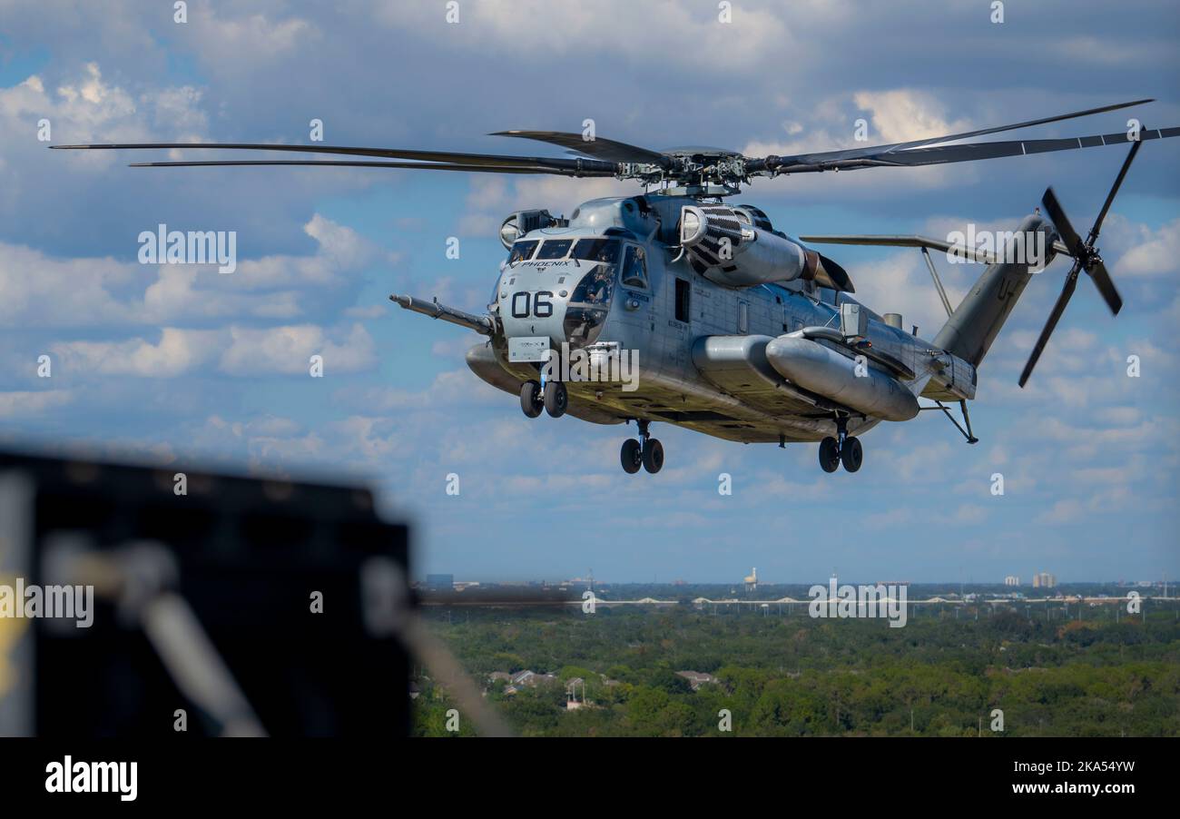 A CH-53E Super Stallion assigned to Heavy Marine Helicopter Training Unit 302, Marine Corps Station New River, North Carolina, flies over Tampa, Florida, during a training exercise, Oct. 25, 2022. The CH-53E can carry a 26,000 pound light armored vehicle or 16 tons of cargo for 100 miles. The helicopter is compact enough to deploy on amphibious assault ships and has the armament, speed and agility to qualify as much more than a heavy lifter. (U.S. Air Force Airman 1st Class Lauren Cobin) Stock Photo