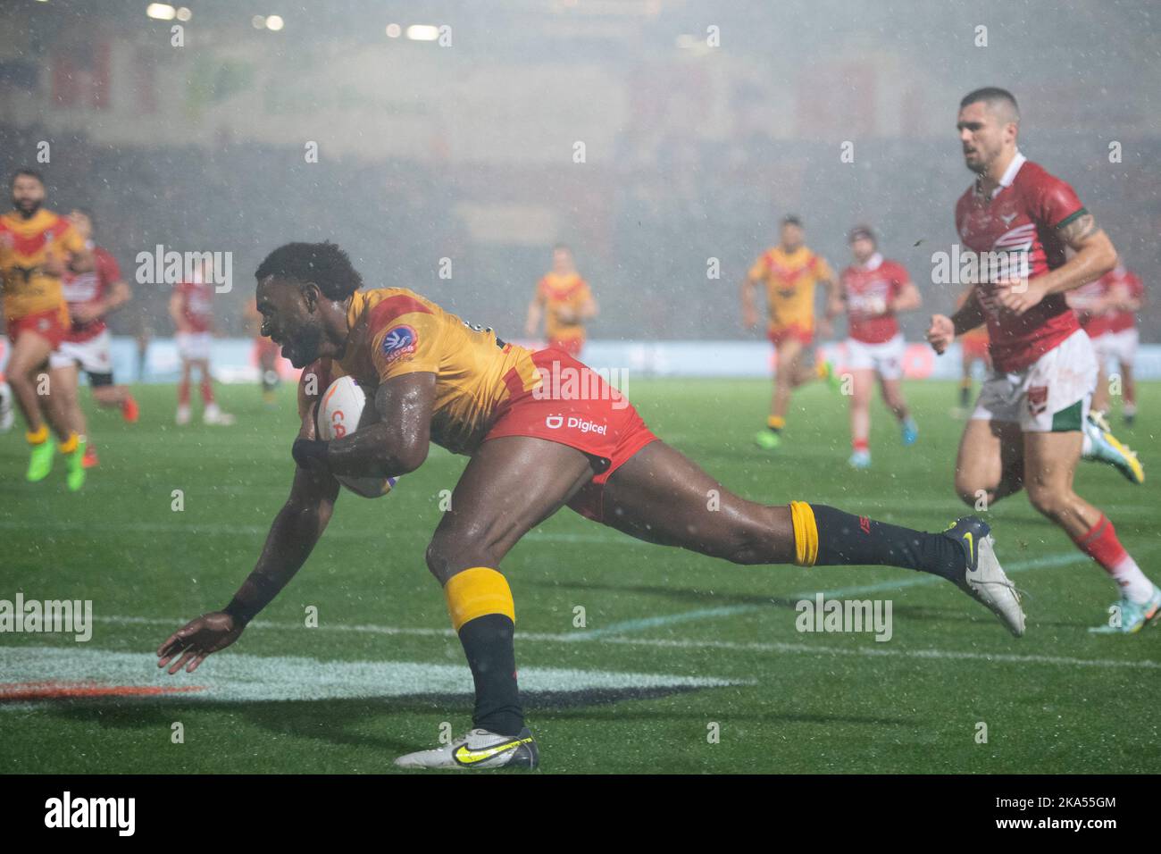 Papua New Guinea Winger Jimmy Ngutlik runs on to score a try during the 2021 Rugby League World Cup Pool D match between Papua New Guinea and Wales at the Eco-Power Stadium,