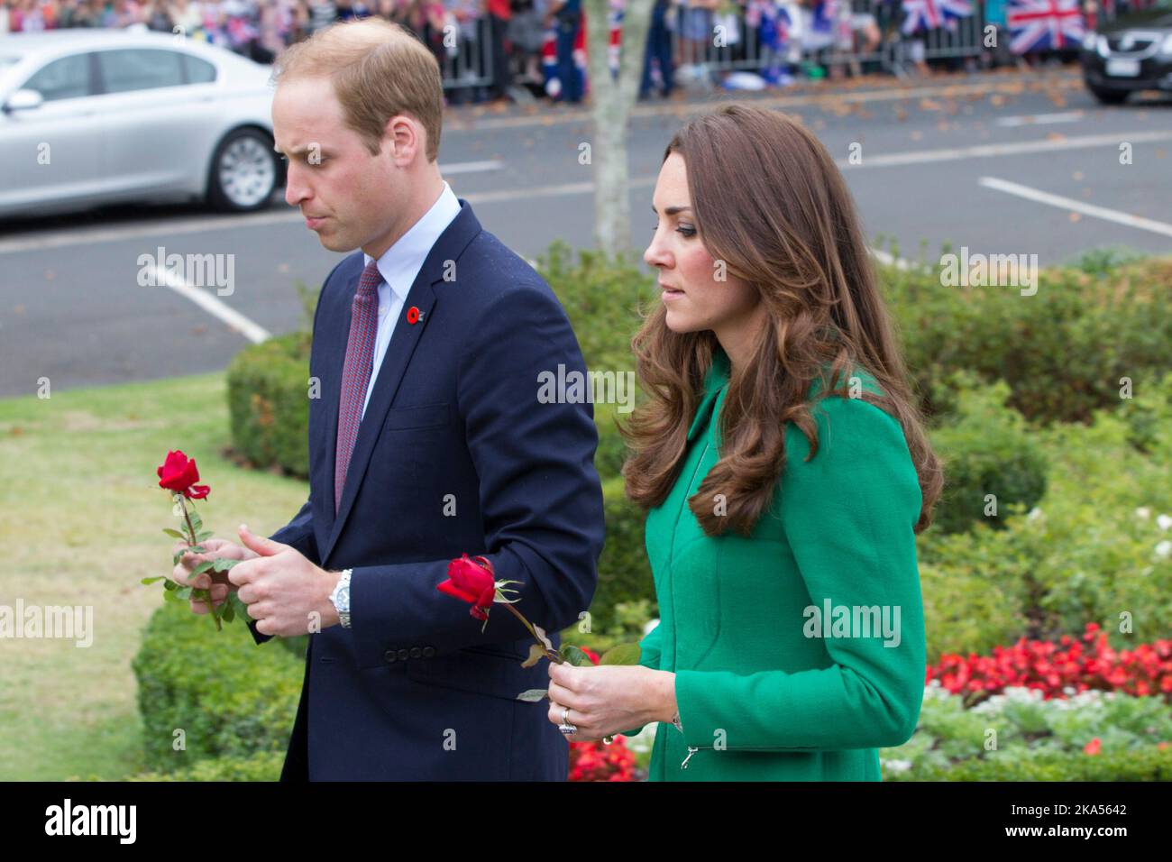 The Duke and Duchess of Cambridge place two roses on the War Memorial, Cambridge, New Zealand, Saturday, April 12, 2014. Stock Photo