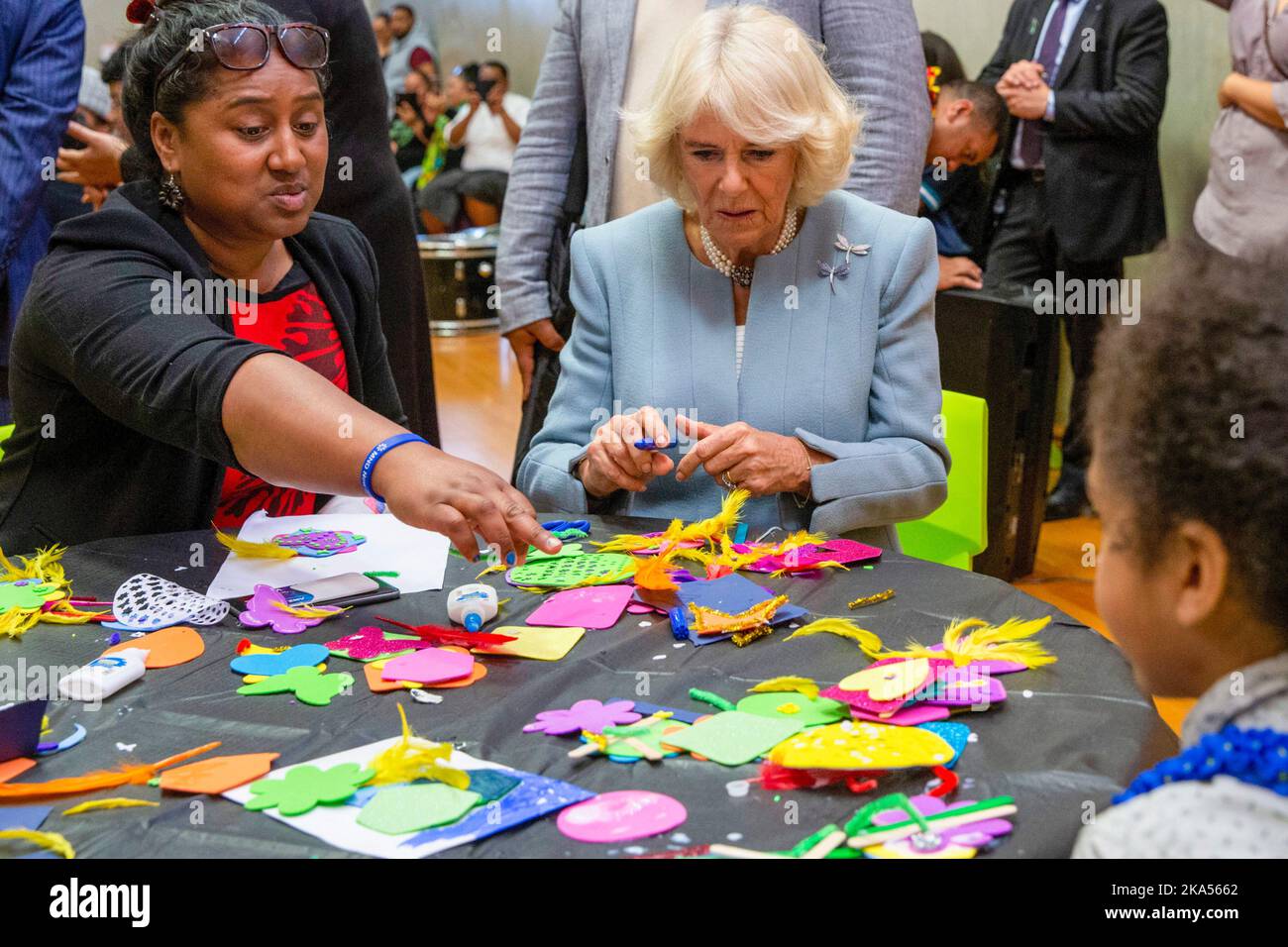 Camilla, Duchess of Cornwall  watches craft activities as she and Prince Charles visit the Wesley Community Centre during their royal visit t Stock Photo