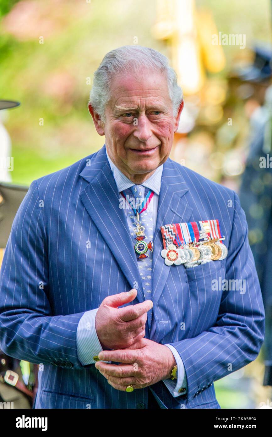Prince Charles inspects the guard as he and Camilla, Duchess of Cornwall attend an official