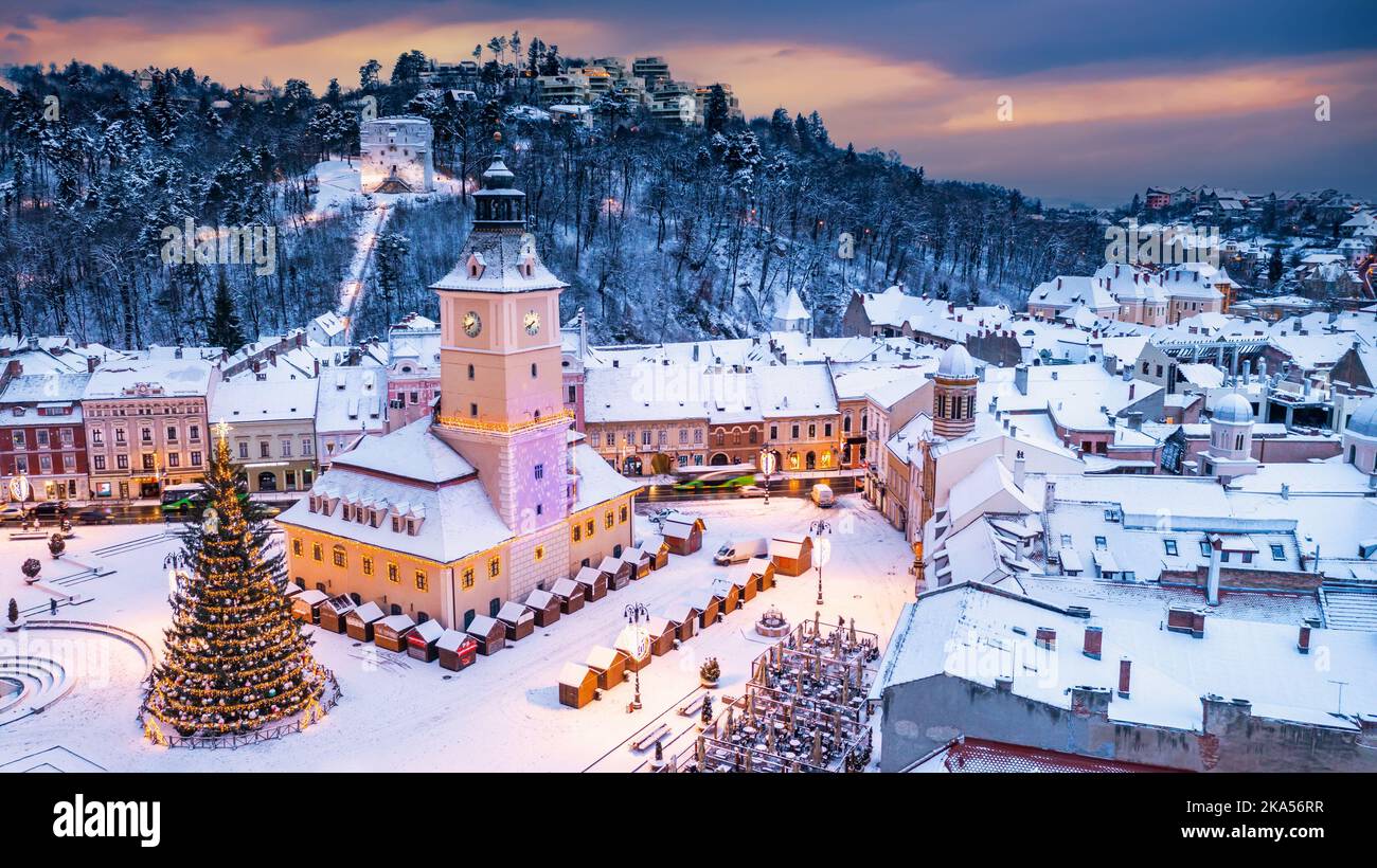 Brasov, Romania. Christmas time landscape with snowy city in Transylvania, Xmas Tree on Christmas Market. Stock Photo