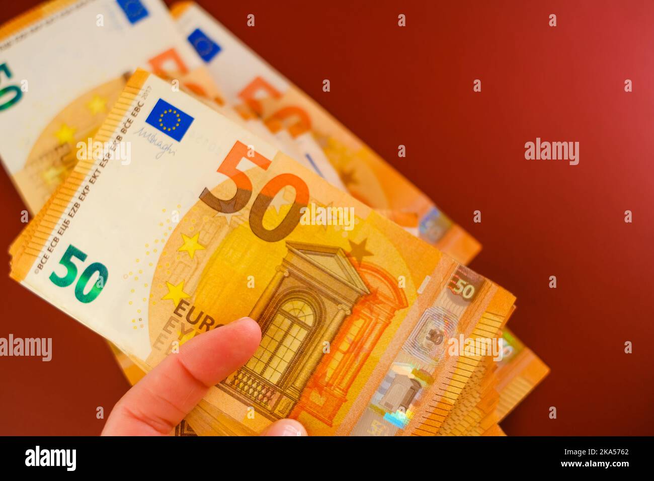 Euro banknotes in hands closeup.50 euro banknotes in hand on a