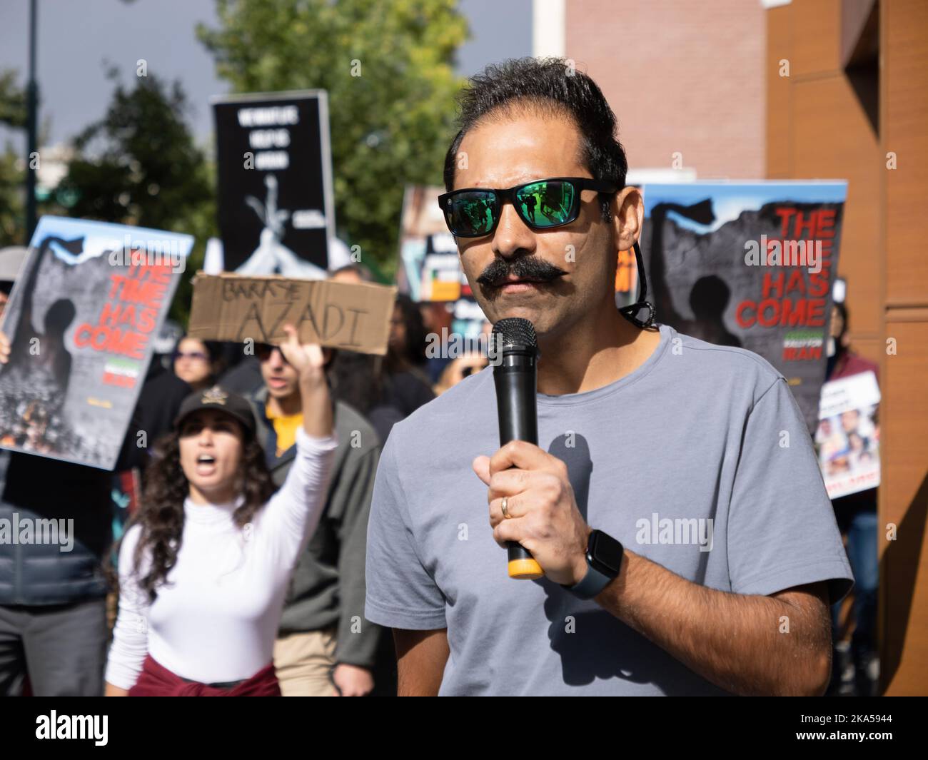 A protester speaks into a microphone during a demonstration march decrying the Iranian government and the death of Masha Amini. Starting at the University of Nevada, hundreds of Reno's more than 2,000 Iranian Americans marched through downtown Reno calling for the end of what they said was Iranís oppressive, religious regime.Masha Amini was a central figure in the demonstrations. Amini was abducted by Iran's morality police and allegedly was murdered while in the custody of the Iranian government. (Photo by Bob Conrad/SOPA Images/Sipa USA) Stock Photo