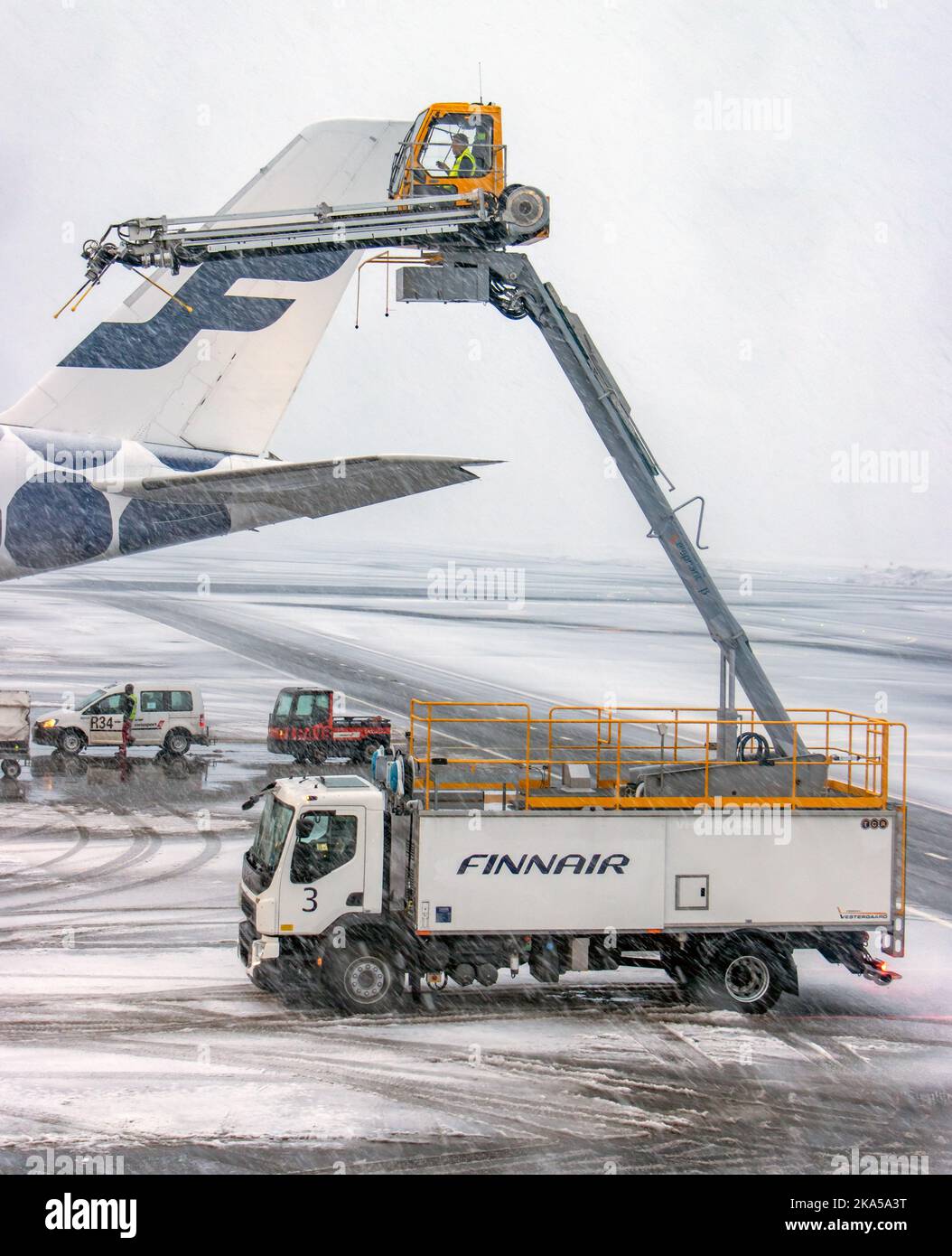 HELSINKI, FINLAND, FEB 15 2022, A aircraft de-icing (anti-icing) using ...