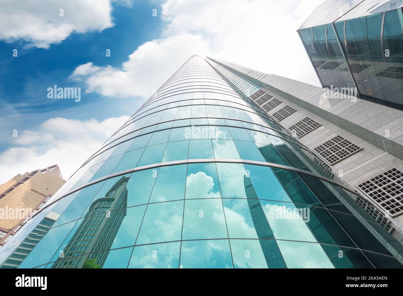 Clouds reflected in windows of modern office building Stock Photo - Alamy