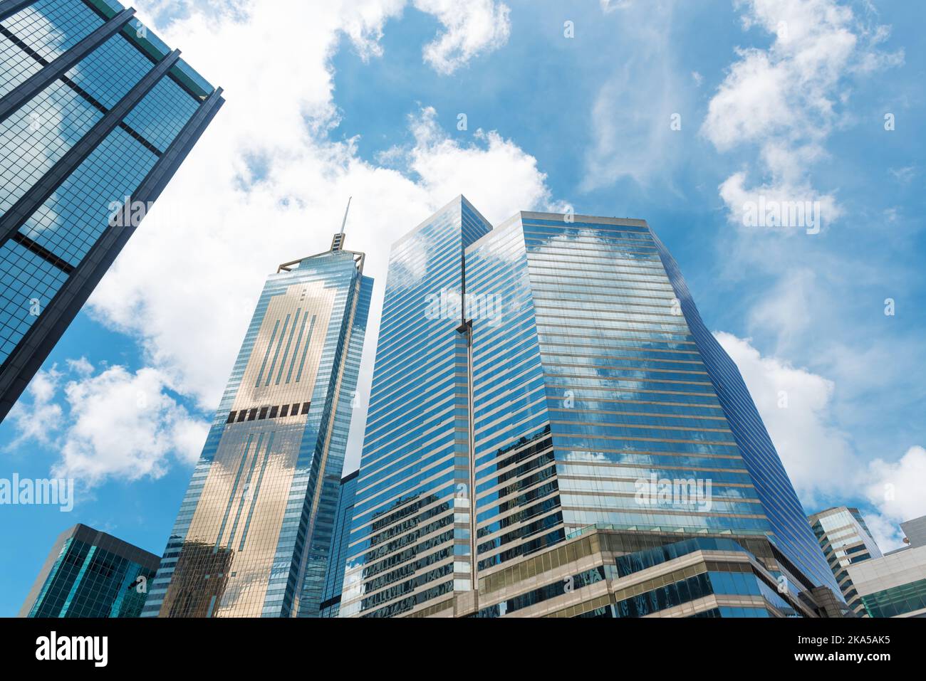 Clouds reflected in windows of modern office building Stock Photo - Alamy