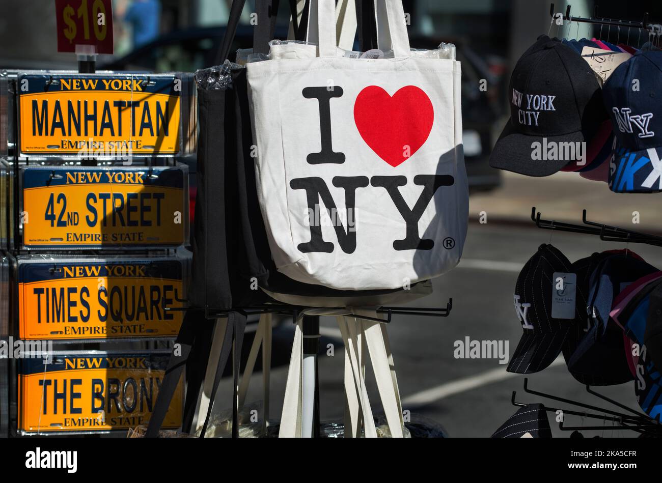 I Love New York bag hanging outside with other New York City souvenirs on a Chinatown Street corner on a fall afternoon in lower Manhattan. Stock Photo