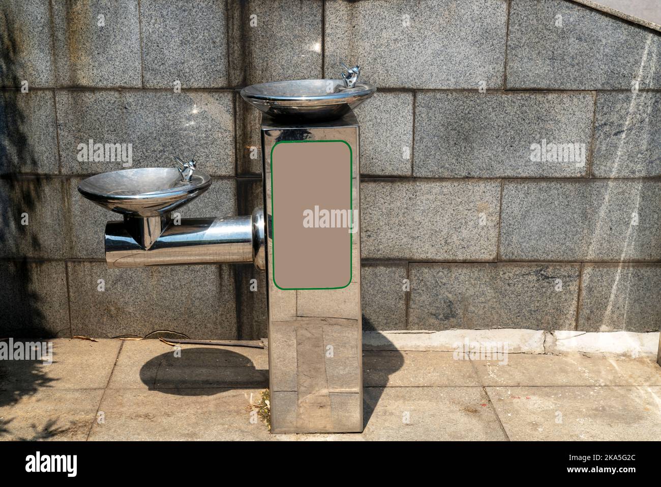 Public free drinking fountain tap made of stainless stell in modern