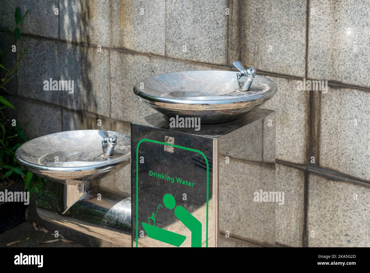 Public free drinking fountain tap made of stainless stell in modern