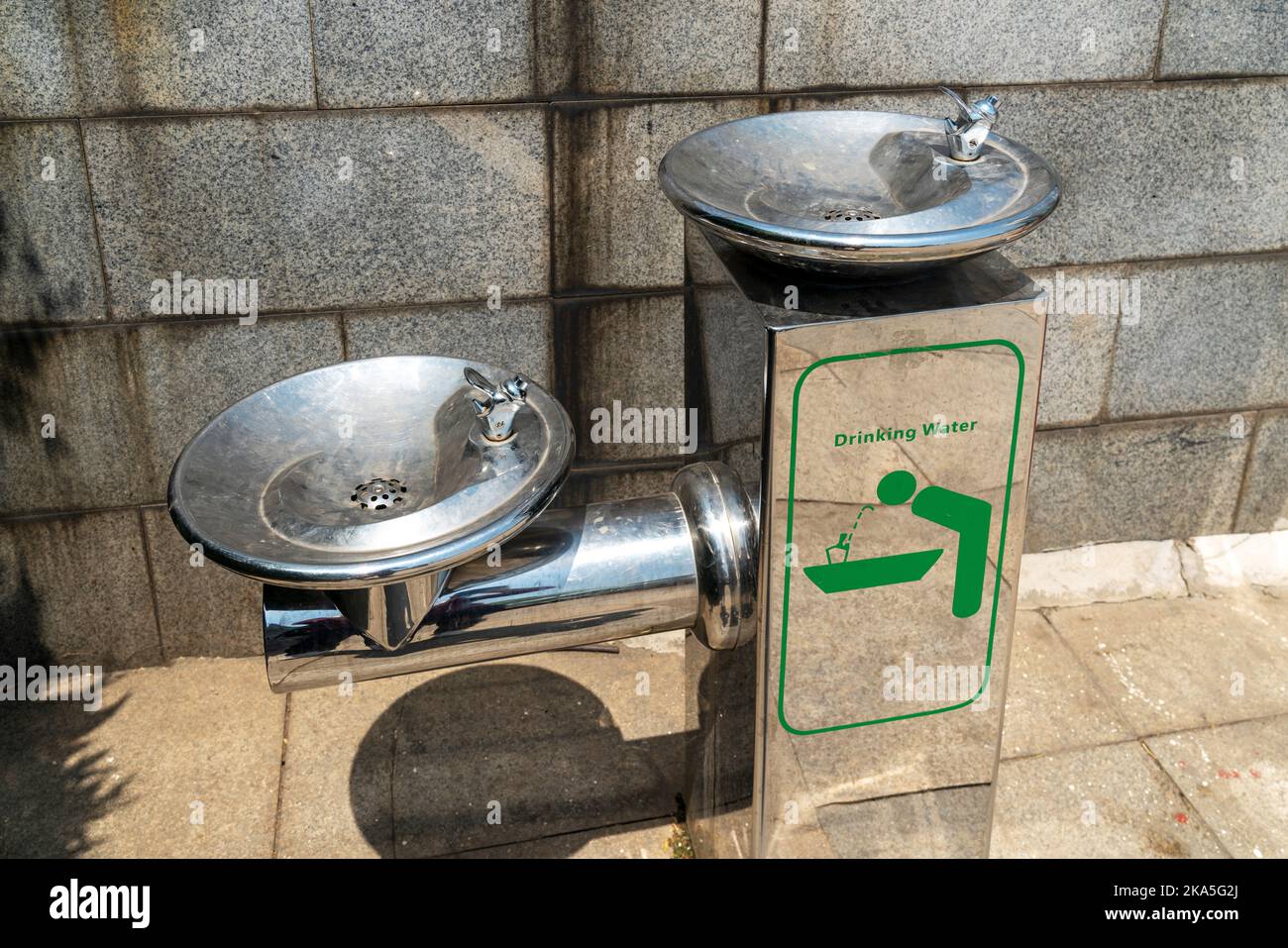 Public free drinking fountain tap made of stainless stell in modern