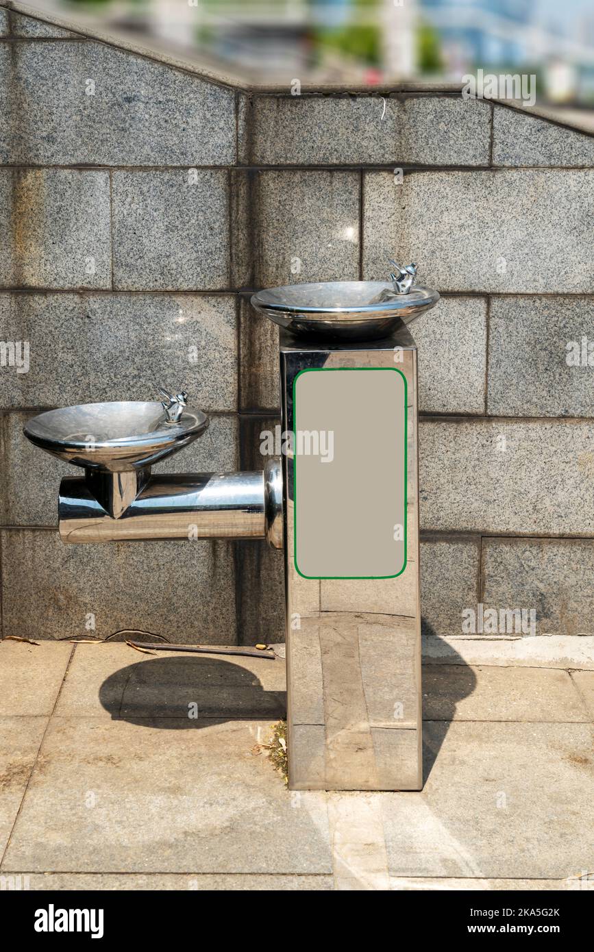 Public free drinking fountain tap made of stainless stell in modern design Stock Photo Alamy