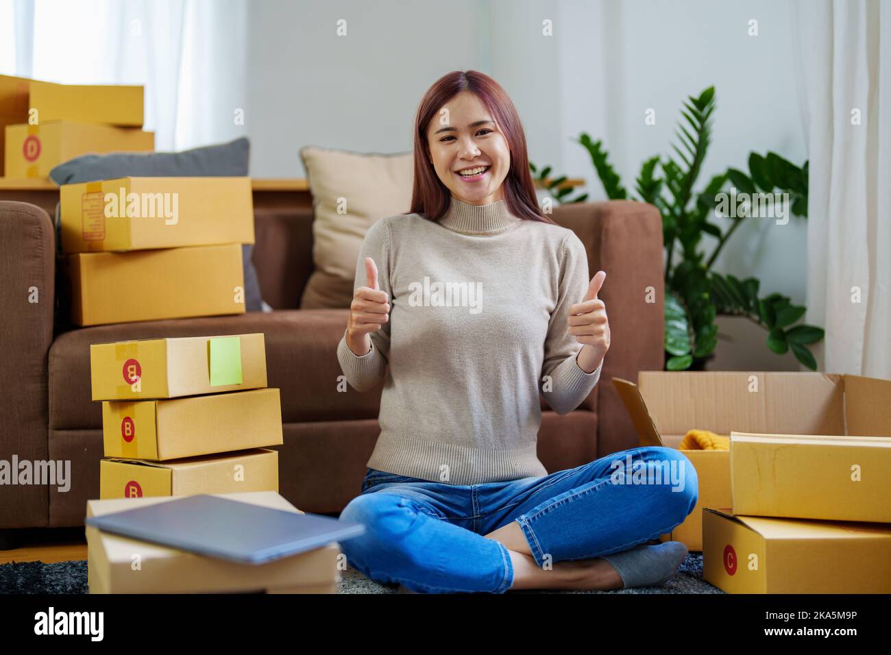 Portrait of a small startup Asian female entrepreneurs, SME owners showing smiling faces from successful business operations Stock Photo