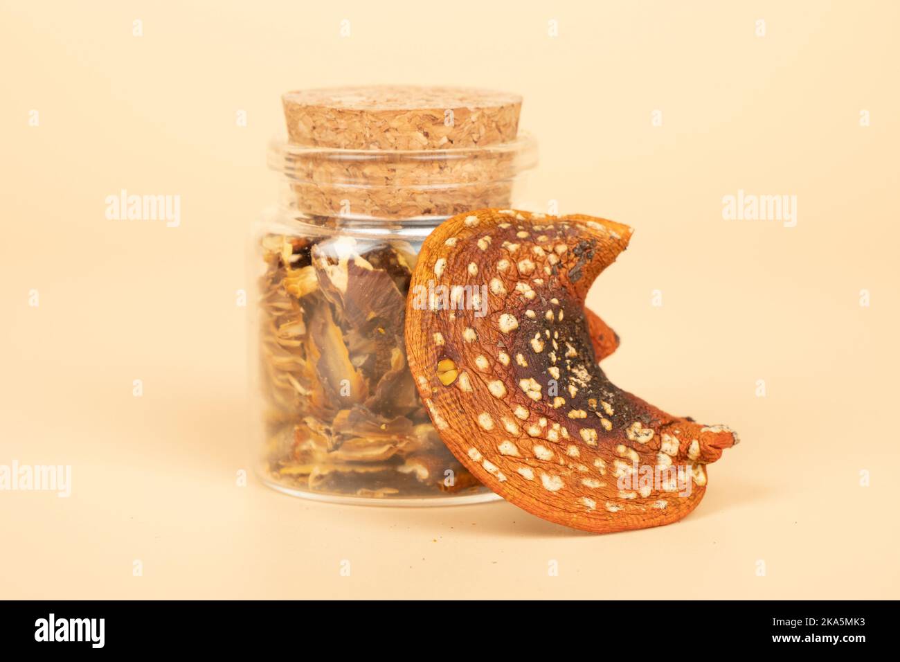 dried fly agaric in a jar for the microdosing use closeup, hack mind mushrooms. Stock Photo