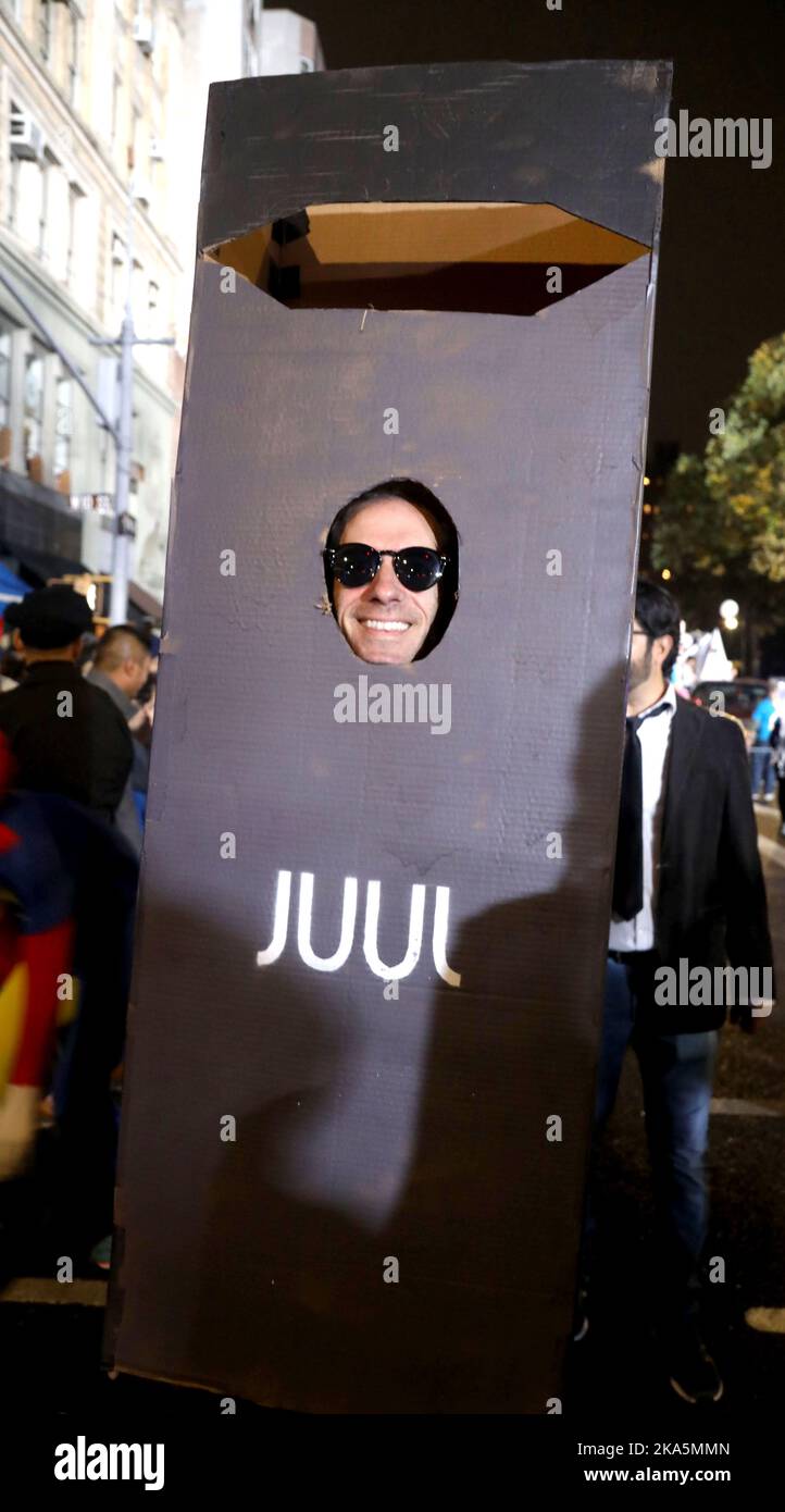 October 31, 2022, New York City, New York, USA: A parade goer wears a JUUL  costume at the New York City's 