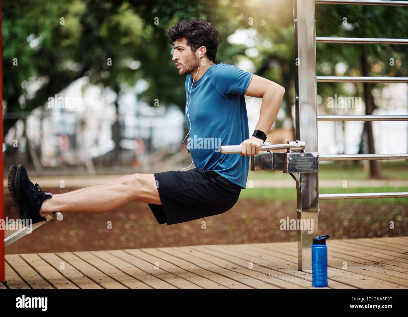 Focus on your breathing. a sporty young man doing stretching techniques while exercising outdoors. Stock Photo