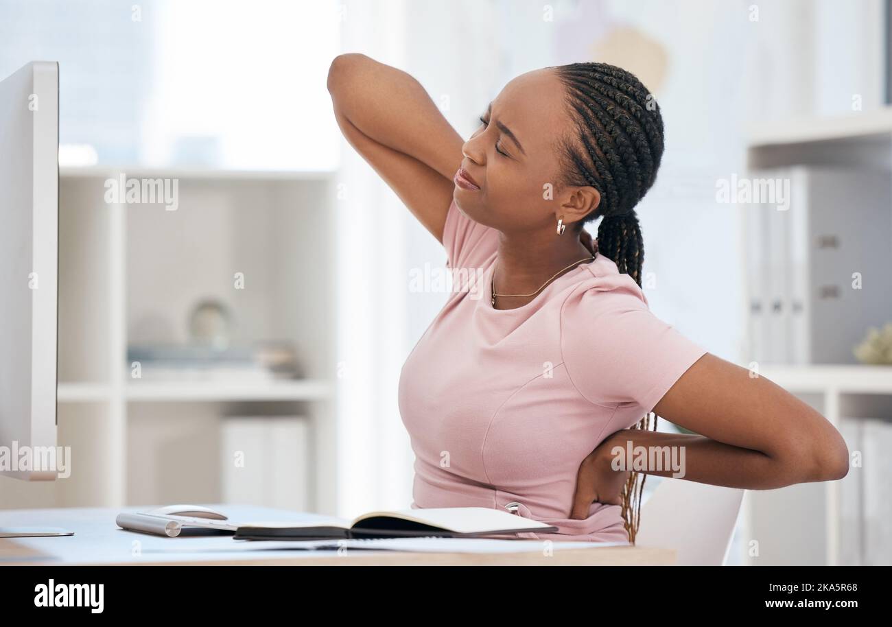 Burnout, stress and tired black woman with back pain in the office due