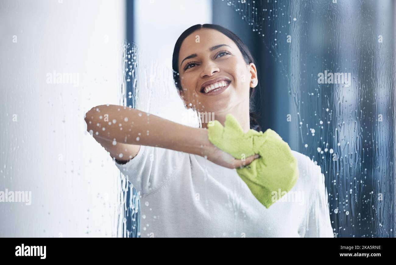Cleaning, glass and hygiene with a black woman using a cloth or rag