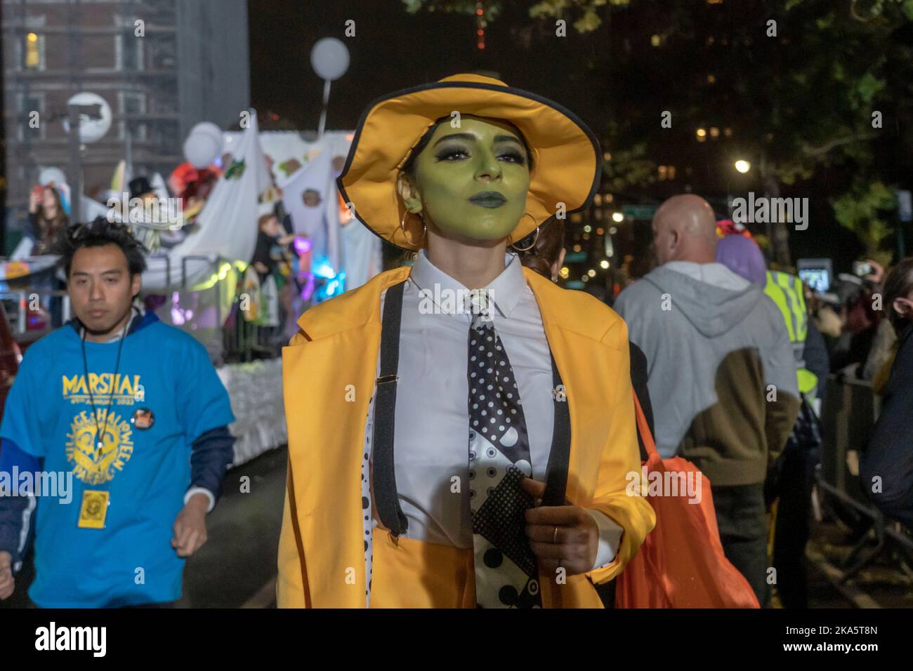 NEW YORK, NY - OCTOBER 31: A reveler dressed as The Mask participates ...