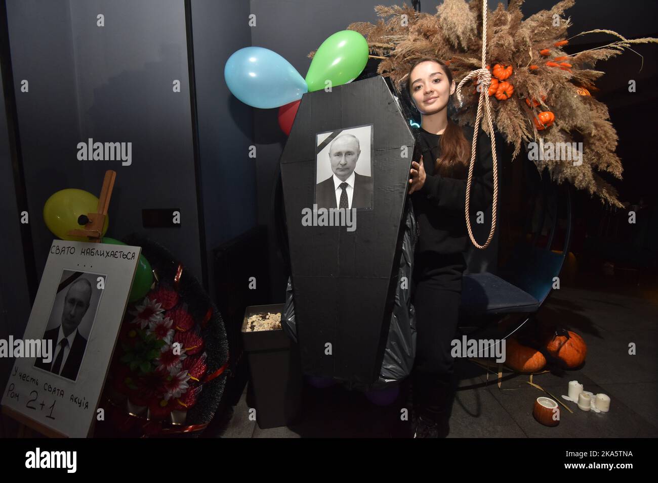 A Girl Holds A Coffin With A Portrait Of Russian President Vladimir