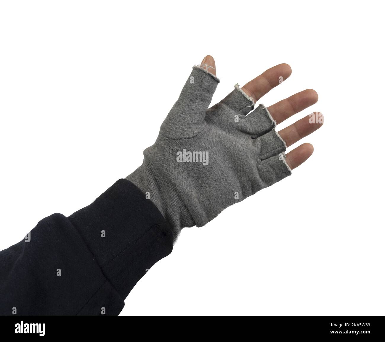 a man puts on fingerless woolen gloves on a transparent background Stock Photo