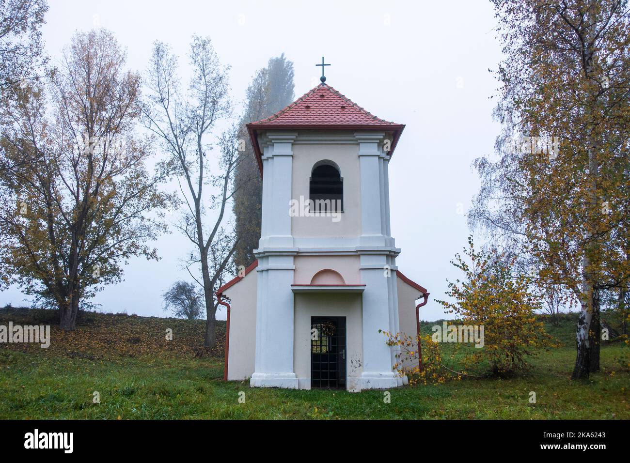 Chapel of the Nativity of the Virgin Mary at the site of the extinct village of Hermanice in thick fog near the Nuclear Power Plant Dukovany, older of Stock Photo