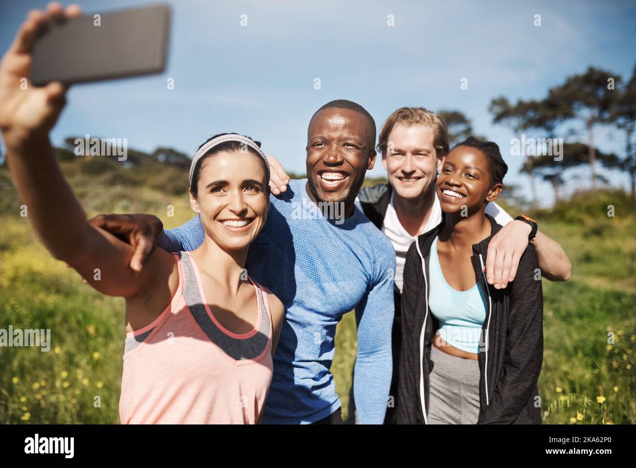 This one will be my profile picture. a group of friends taking a selfie outdoors after their workout. Stock Photo