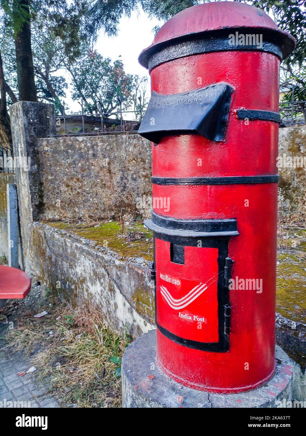 December 6th 2019 Dehradun City Uttarakhand India. India Post services. Vintage Red letter box. Stock Photo