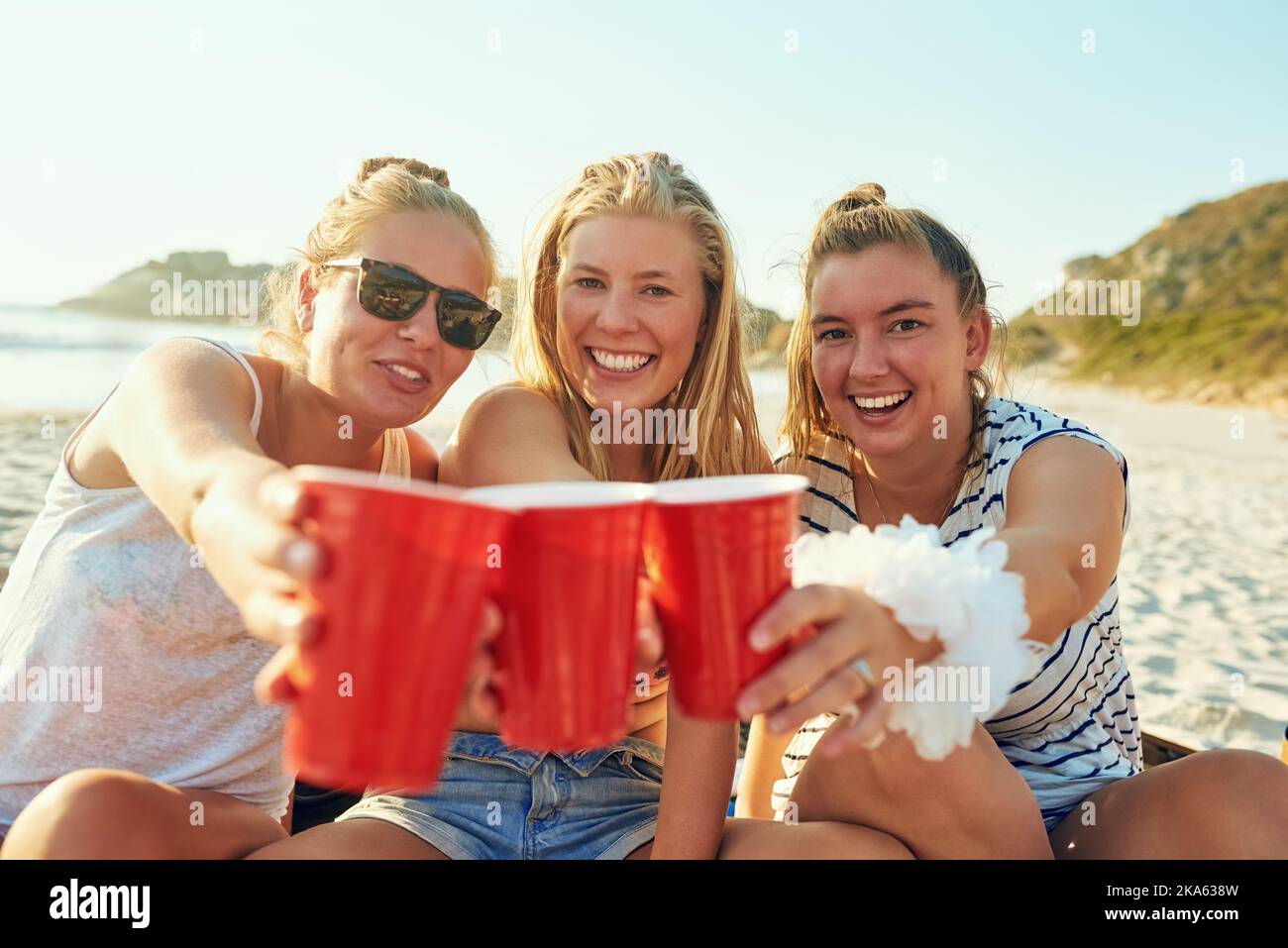 Celebrating our friendship. young female best friends hanging out at the beach. Stock Photo