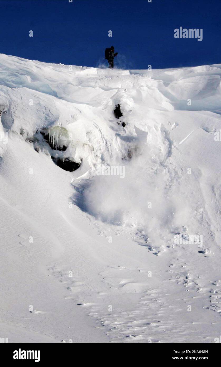 Avalanche Researcher Krister Kristensen NGI shows how easily and fast an avalanche can happen Stock Photo