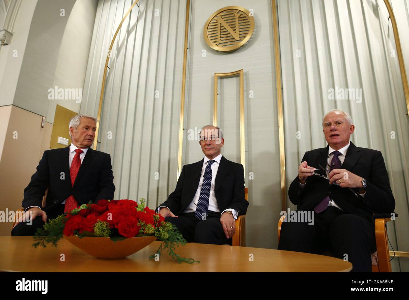Oslo, 20131209: Ahmet Üzümcü (center), director general of OPCW, addresses a press conference at the Nobel Institute, where OPCW (Organization for the Prohibition of Chemical Weapons)  are to receive the 2013 Peace Nobel Prize attributed for its extensive efforts to eliminate chemical weapons.  Left is Chairman of the Norwegian Nobel Committee Thorbjorn Jagland, and right is Geir Lundestad, head of the Norwegian Nobel Institute.  Photo: Heiko Junge  Stock Photo