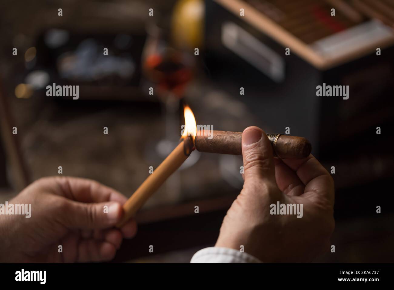 Cuban Cigar two hands lighting a cigar Stock Photo Alamy