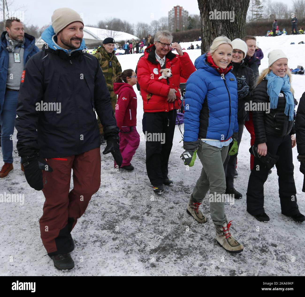 Oslo, Norway 20150113. The Royal Crown Prince Couple visit Toyenparken in Oslo on Tuesday for the opening of the Outdoor Recreation Year 2015 (Friluftlivets aar). 1600 children an youth attended the opening. Crown Prince Haakon and Crown Princess Mette-Marit in the park with mayor Fabian Stang (in red with his puppy). Photo: Lise Aserud / NTB scanpix Stock Photo