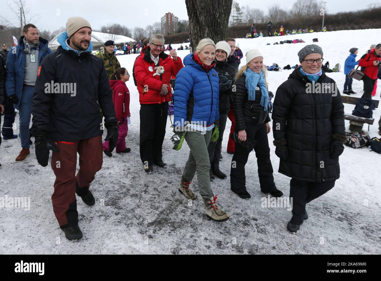 Oslo, Norway 20150113. The Royal Crown Prince Couple visit Toyenparken in Oslo on Tuesday for the opening of the Outdoor Recreation Year 2015 (Friluftlivets aar). 1600 children an youth attended the opening. Crown Prince Haakon and Crown Princess Mette-Marit in the park with mayor Fabian Stang (in red with his puppy). Photo: Lise Aserud / NTB scanpix Stock Photo
