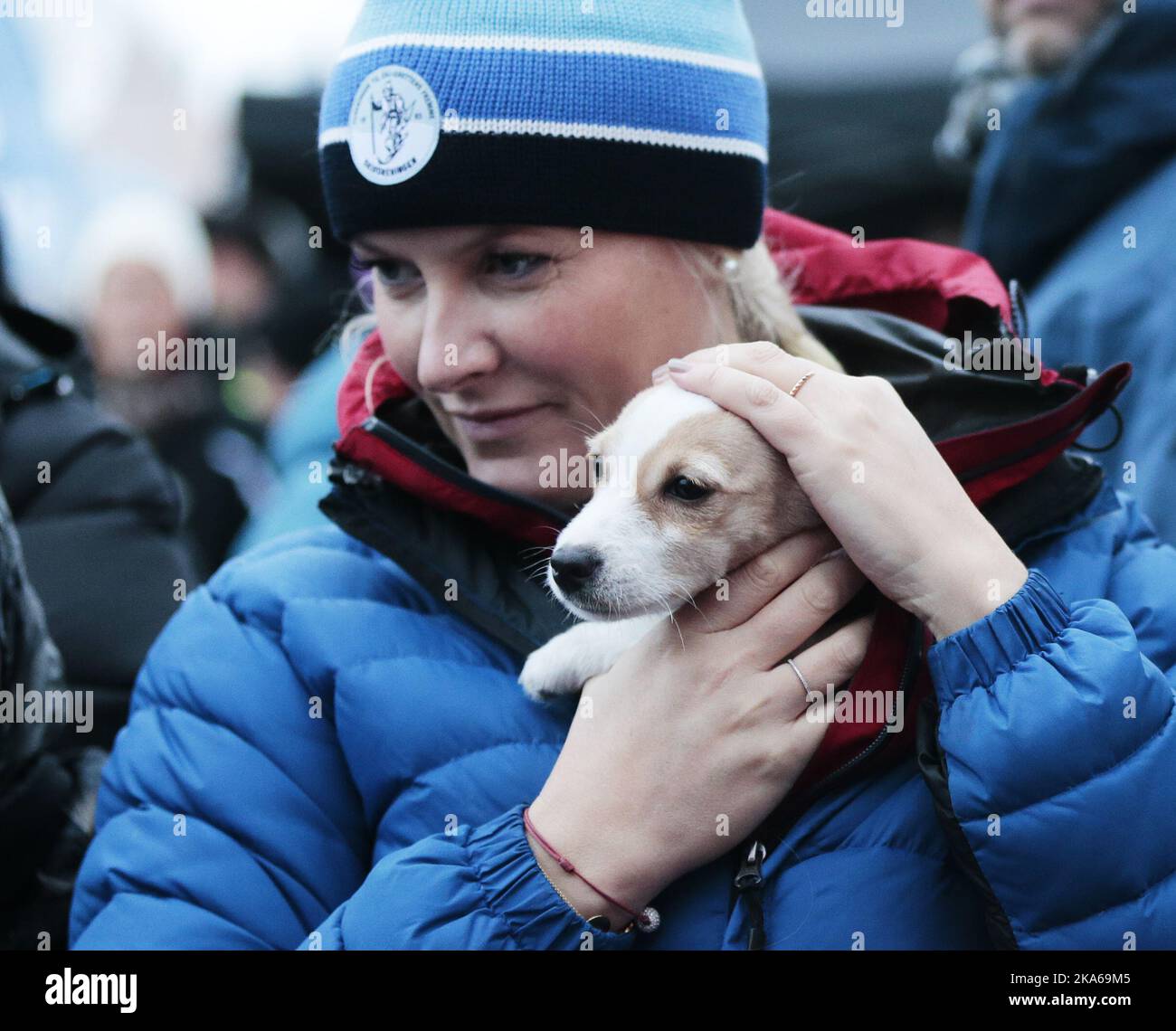 Oslo 20150113. The Royal Crown Prince Couple visit Toyenparken in Oslo on Tuesday for the opening of the Outdoor Recreation Year 2015 (Friluftlivets aar). 1600 children an youth attended the opening. Here puppy 'Toeffen' owned by mayor Fabian Stang receives the royal touch of the Crown Princess Mette-Marit. Photo: Lise Aaserud / NTB scanpix  Stock Photo
