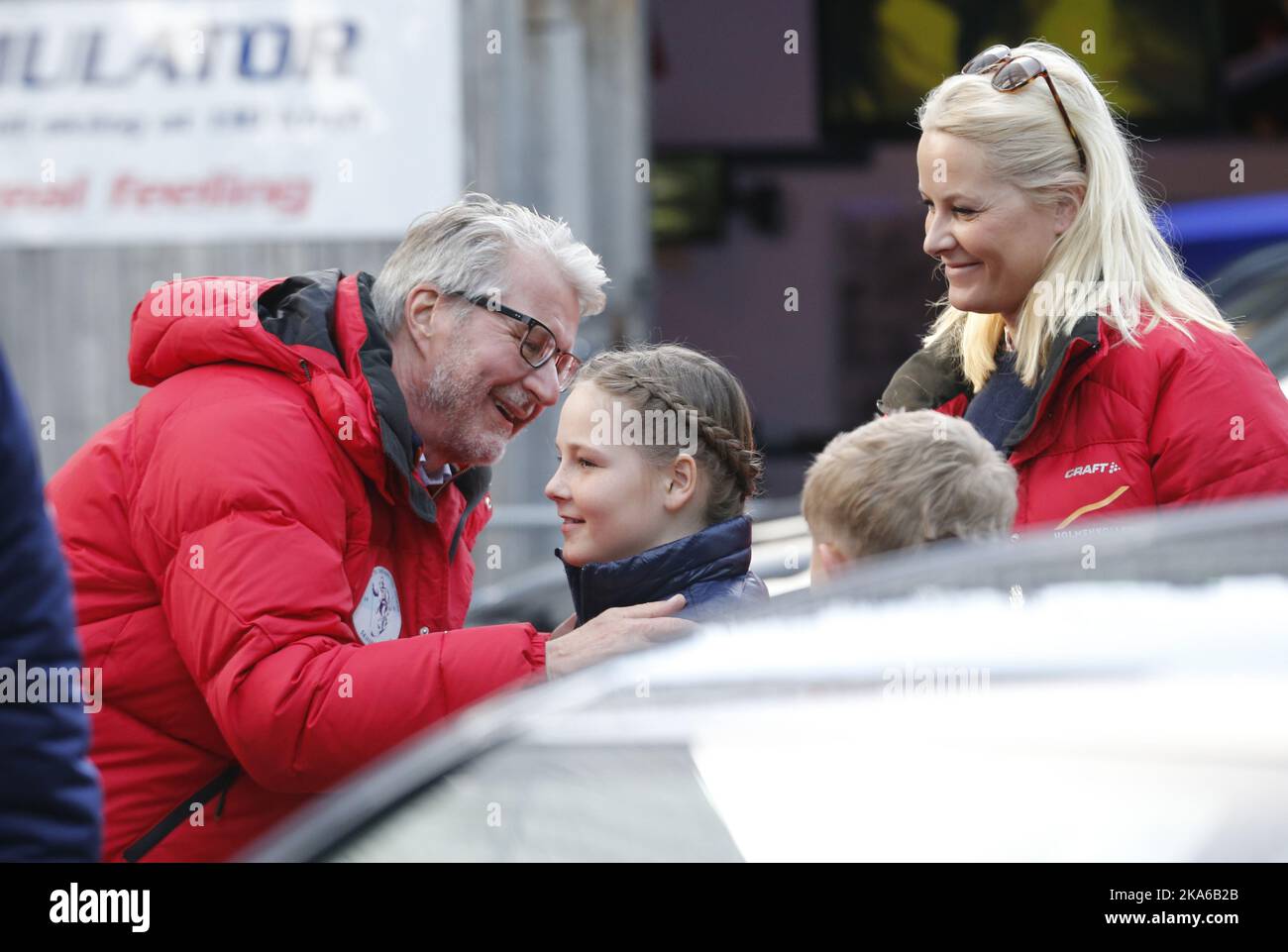 Oslo, Norway, 20150315 The Norwegian Royal Family were present in the Royal box at the Holmenkollen Ski Arena in Oslo Sunday March 15, 2015 for the last World Cup skijump competition of the season. Picture shows Crownprincess Mette-Marit and her children Prince Sverre Magnus and Princess Ingrid Alexandra being greeted on arrival by Oslo-mayor Fabian Stang. Photo: Terje Bendiksby / NTB scanpix  Stock Photo