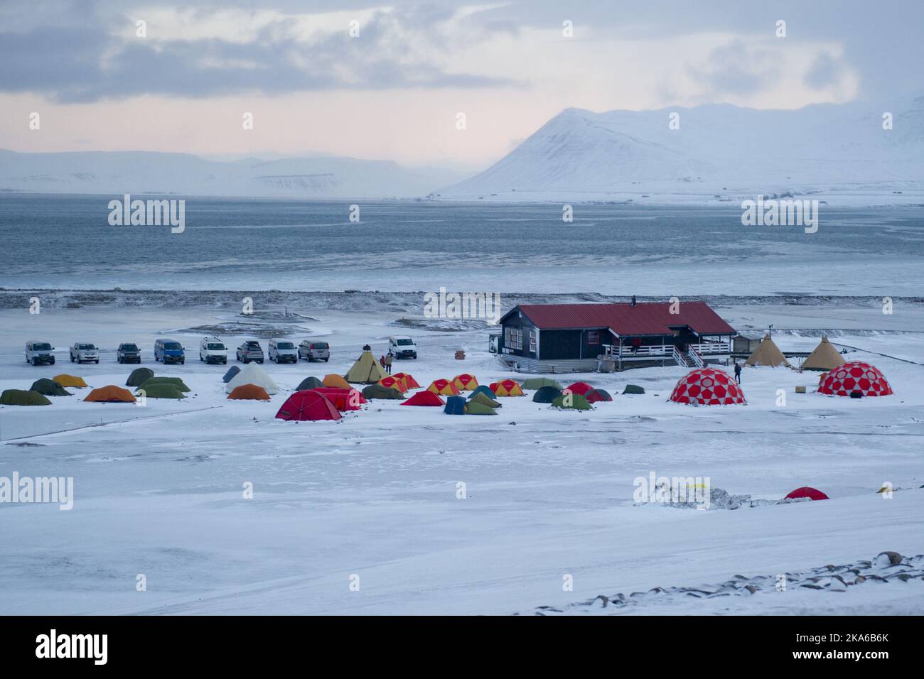 Longyearbyen, Svalbard, Norway 20150320. The view over Longyearbyen Camping on Svalbard at half six in the morning on March 20, 2015. Most accommodation in Longyearbyen has been sold out for several years and many tourists therefore uses camp sites to stay before they will see the total solar eclipse that hit Svalbard Friday morning . The temperature in Longyearbyen has varied between 15 and 20 degrees below zero in the last day. Photo: Jon Olav Nesvold / NTB scanpix Stock Photo