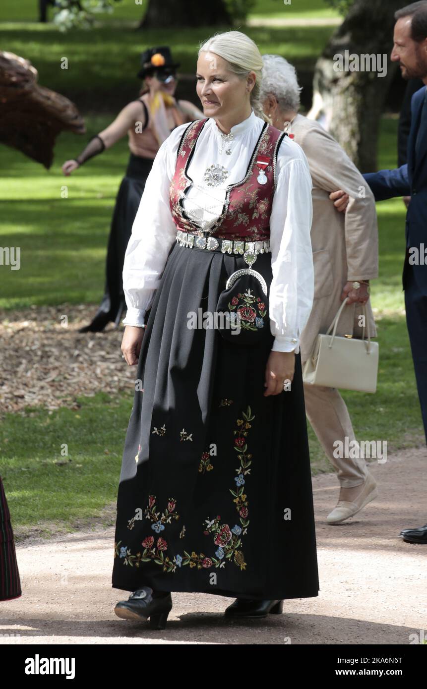 Oslo, Norway 20160901. Their Majesties The King and Queen host a garden party for 1 500 guests in the Palace Park. Crown Princess Mette-Marit are wearing a national costume from Vest-Agder and Kong Harald Vs jubileumsmedalje 1991Â–2016 (King Harald V's Jubilee medal 1991-2016). Photo: Lise Aaserud / NTB scanpix Stock Photo