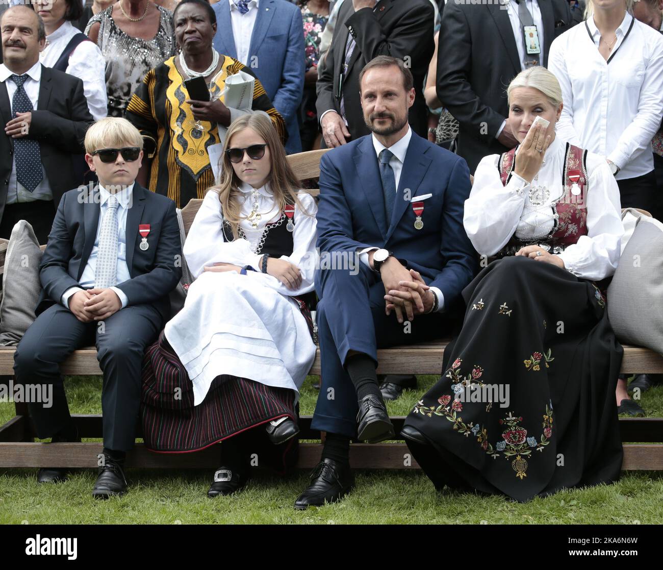 Oslo, Norway 20160901. Their Majesties The King and Queen host a garden party for 1 500 guests in the Palace Park. Princess Mette-Marit crying during the garden party. From left: Prince Sverre Magnus, Princess Ingrid Alexandra, Crown Prins Haakon and Crown Princess Mette-Marit Photo: Lise Aserud / NTB scanpix [LANUAGESEPARATOR] Oslo 20160901. Kronprinsesse Mette-Marit grater under hageselskapet. Kong Harald og dronning Sonja inviterer til hageselskap i Dronningparken. Kronprins Haakon, kronprinsesse Mette-Marit, prinsesse Ingrid Alexandra, prins Sverre Magnus og prinsesses Astrid deltar ogsa  Stock Photo
