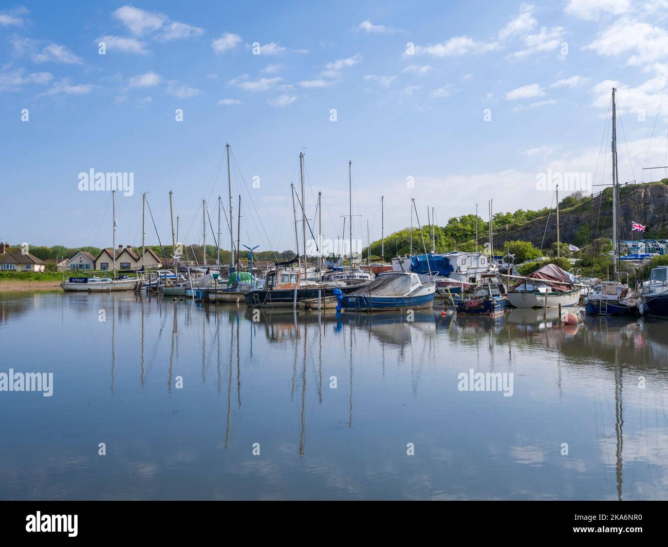 Boats at Uphill Marina beside the River Axe estuary at high tide, Uphill, North Somerset, England. Stock Photo