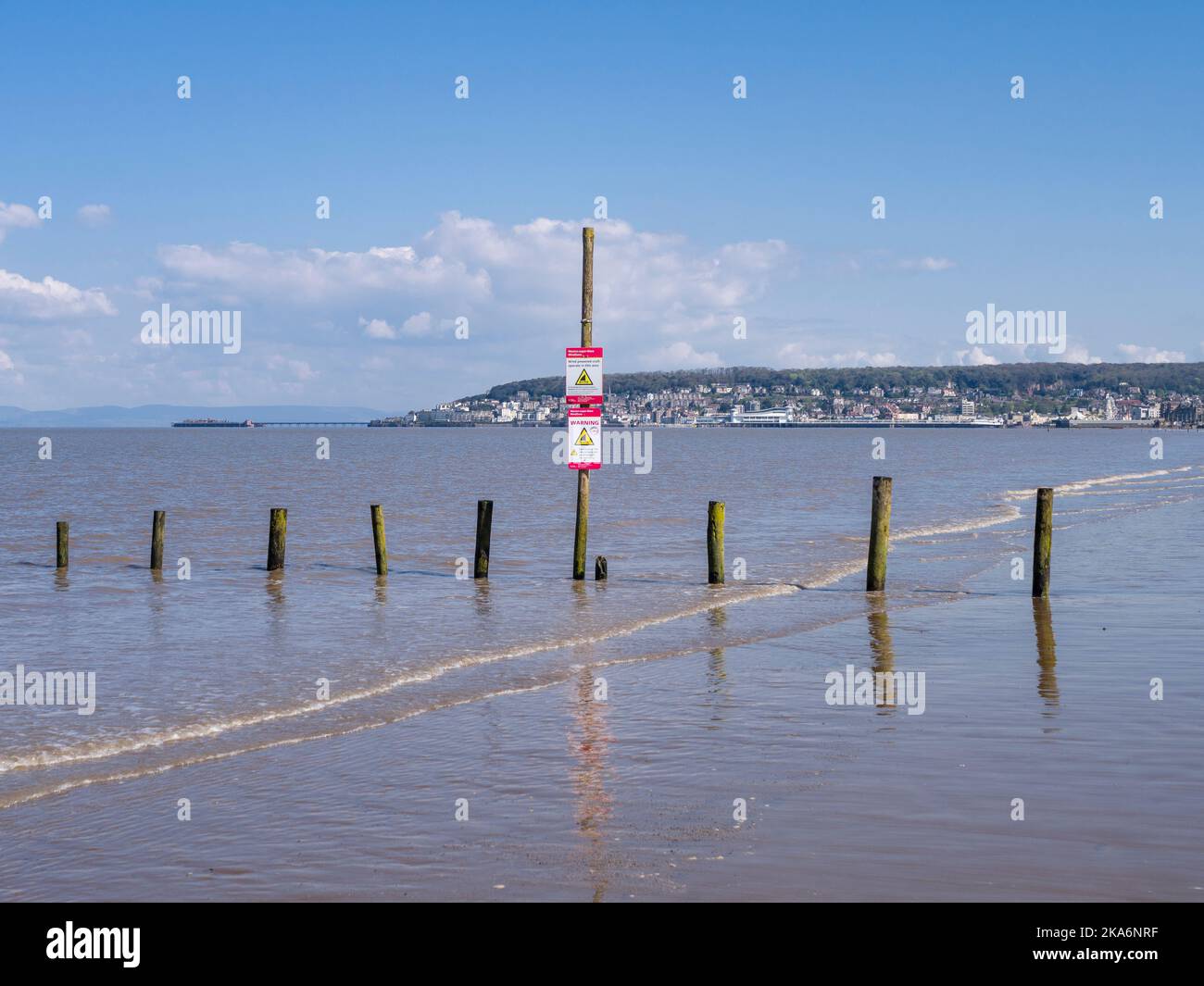 The beach at Uphill during high tide with Weston-super-Mare beyond, North Somerset, England. Stock Photo